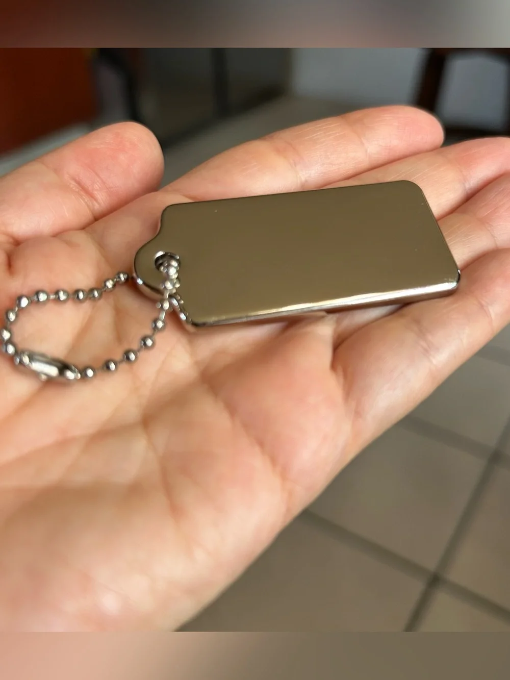 Coach New York silver-tone metal hangtag bag charm